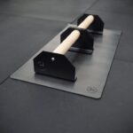small forte fitness parallette bars on a mat