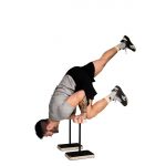 man performing a press to handstand on wooden forte fitness canes
