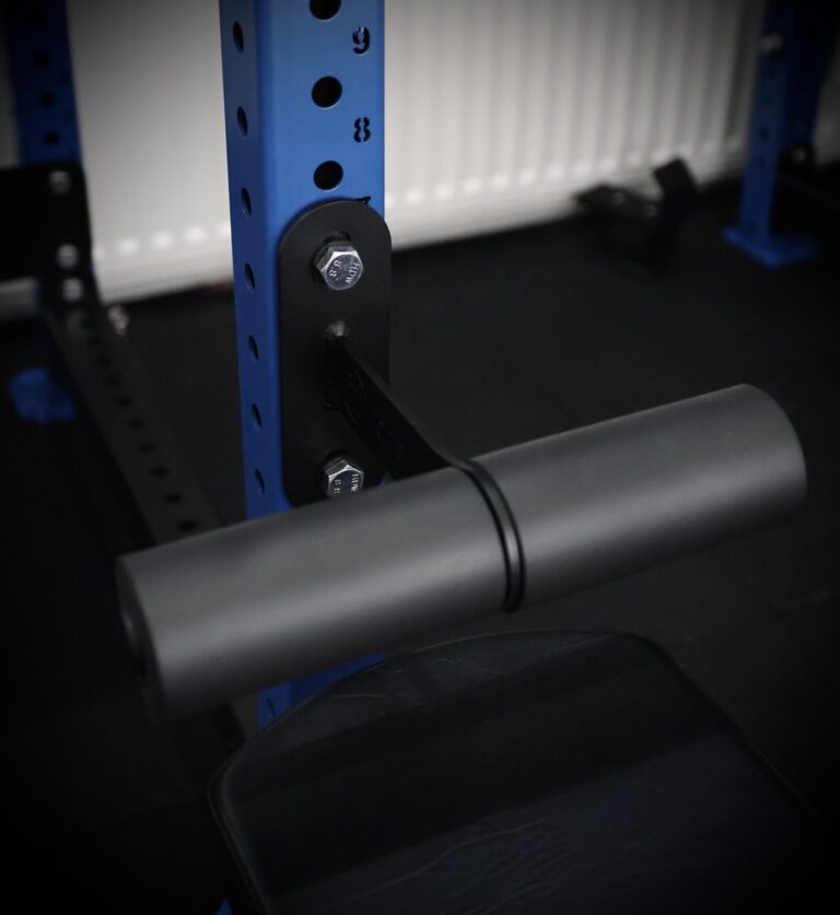 nordic curl attachment mounted on a blue rack
