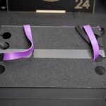 slant platform set up in a gym with purple resistance band