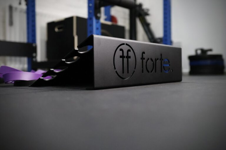 slant platform set up in a gym with purple resistance band