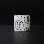 white thumb tape with black FF logo on black background