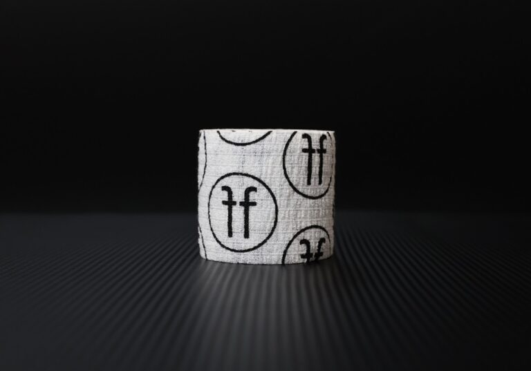 white thumb tape with black FF logo on black background