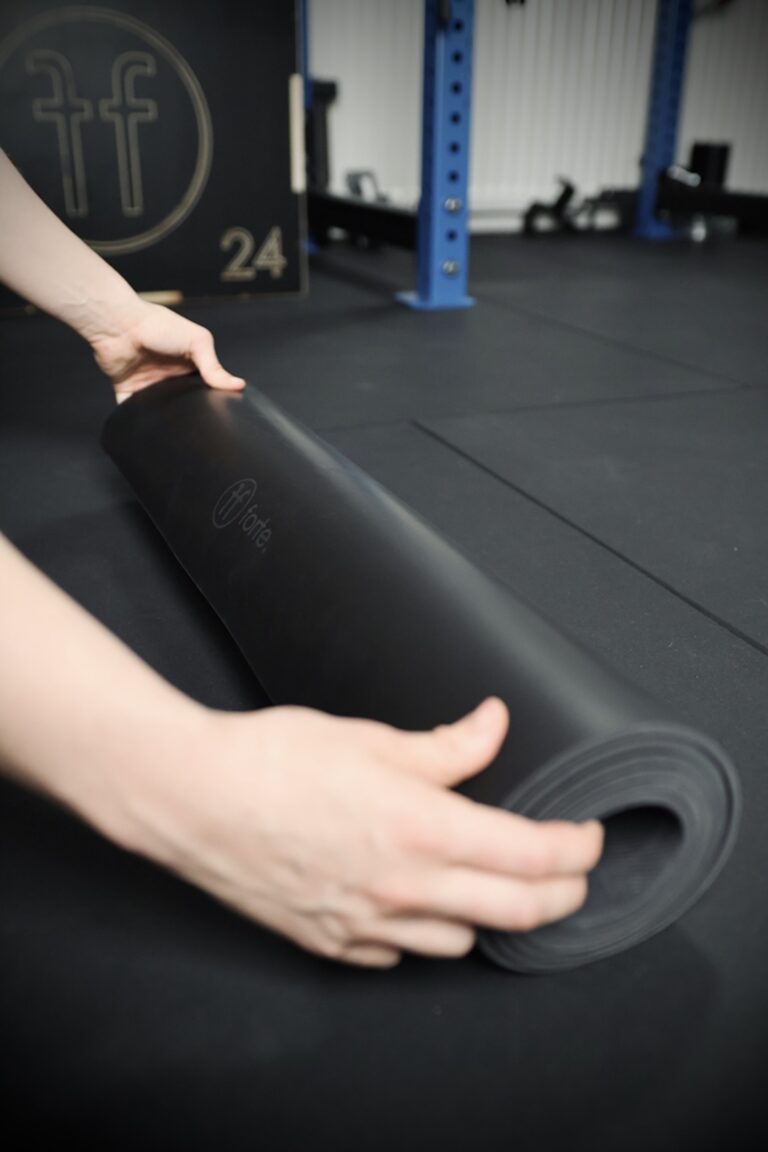 girl unrolling the forte fitness yoga mat